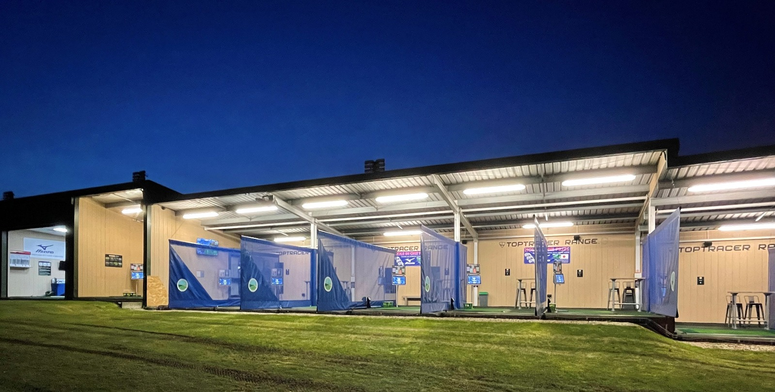 Winchester Golf Academy Toptracer bays at dusk