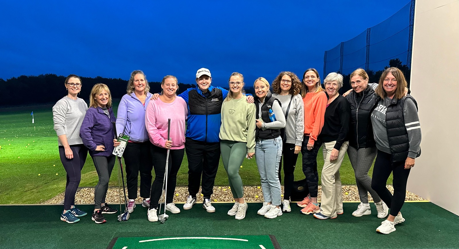 Ladies coaching group celebrating after a session